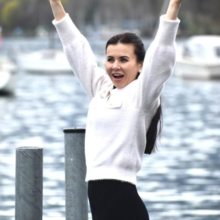 Kaveri Mehta, Lead Design Curator at ForestAnchorSaffron, reviewing corporate floral arrangements